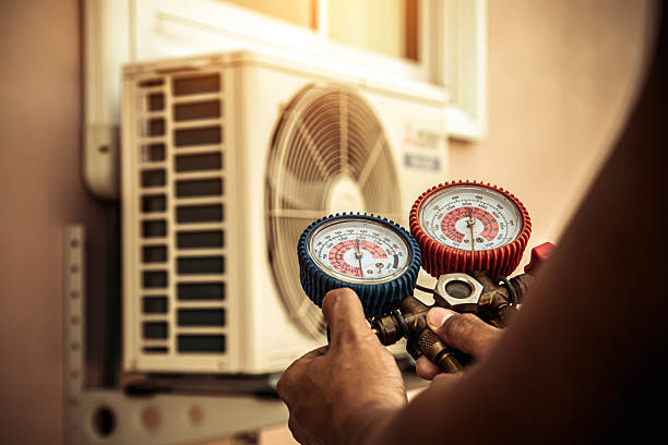 Professional Air Conditioning Service technician working in Port Byron, NY
